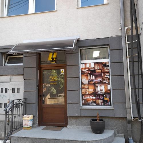a store front with a door and a window at Center lux Apartments in Bitola
