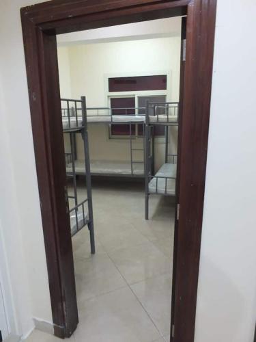 a mirror in a room with bunk beds at Gulf building in front of al noor mosque in Sharjah