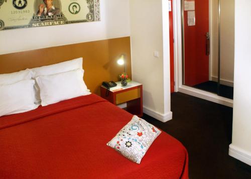 Ein Bett oder Betten in einem Zimmer der Unterkunft Hotel Joao XXI