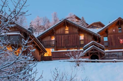 a log home in the snow at Chalet Clearmount with Spa in Méribel
