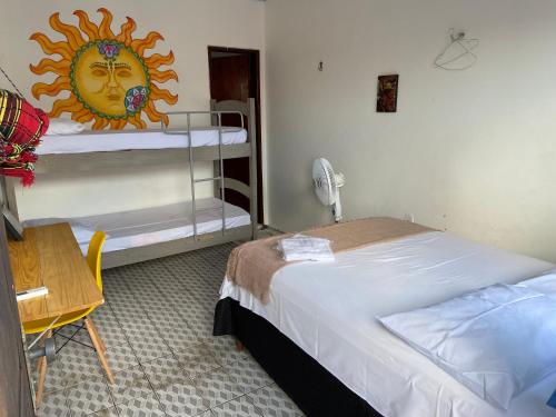 Ένα ή περισσότερα κρεβάτια σε δωμάτιο στο Casa Guarnicê Hostel