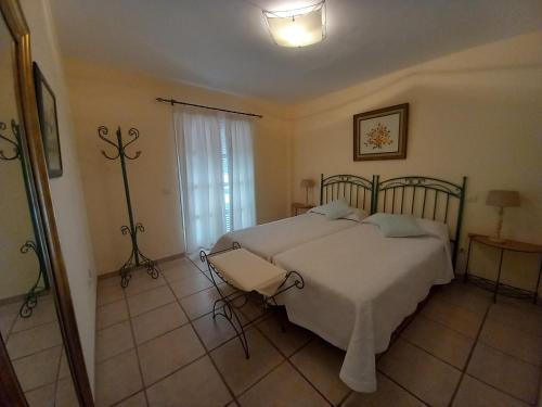 a bedroom with a bed and a table in it at Apto. PIÑA DE MAR in Adeje