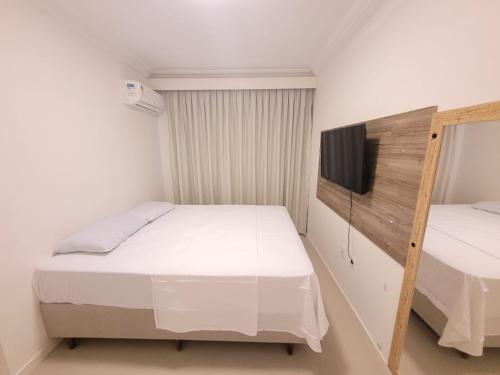 Giường trong phòng chung tại Apartamento Rota do Mar