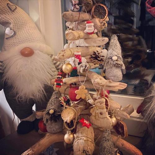 a christmas tree with ornaments on top of it at Bjørkli Lodge in Geilo