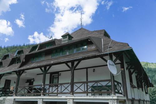 a large building with a roof on top of it at Maja Lux Apartman Brzece in Brzeće
