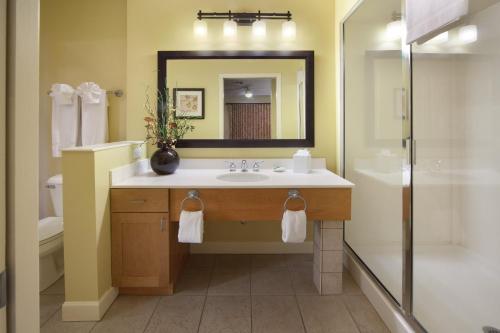 a bathroom with a sink and a shower at Holiday Inn Club Vacations at Lake Geneva Resort, an IHG Hotel in Lake Geneva