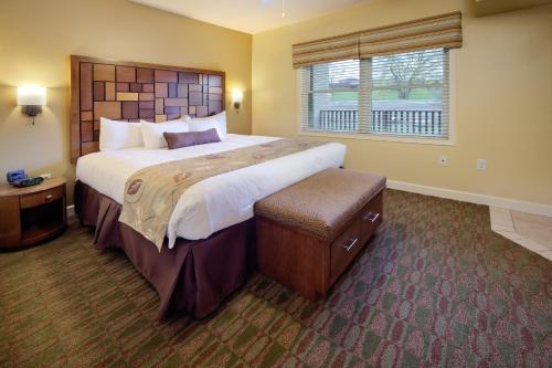 a large bedroom with a large bed and a window at Holiday Inn Club Vacations at Lake Geneva Resort, an IHG Hotel in Lake Geneva
