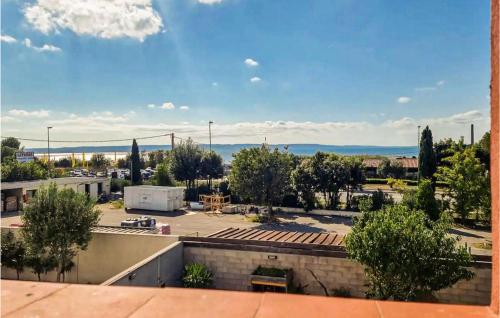 a view of a parking lot with a view of the ocean at 4 Bedroom Beautiful Home In Rognac in Rognac