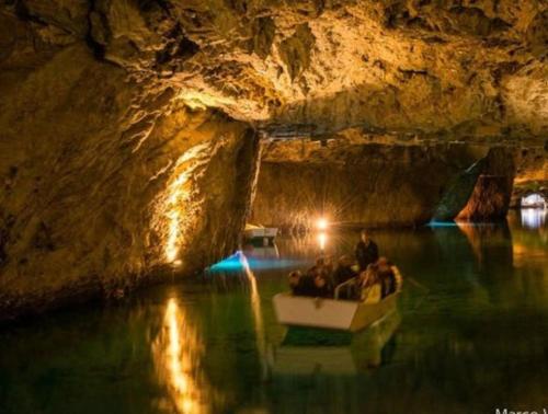 a group of people in a boat in a cave at Vacances en tout tranquillité à Vercorin in Vercorin