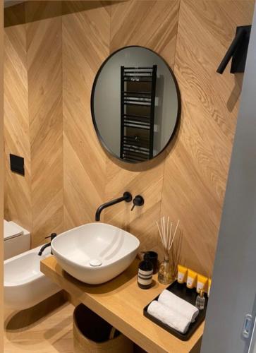 a bathroom with a sink and a mirror at Fiorini Rooms Sora in Sora