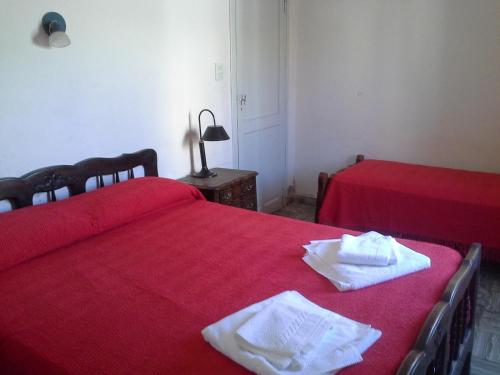 Ένα ή περισσότερα κρεβάτια σε δωμάτιο στο Galicia Accomodation