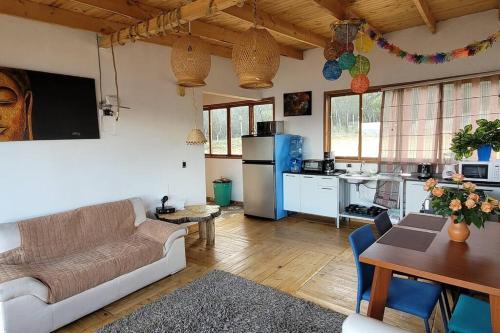 a living room with a couch and a table at Villa Vista in Guatavita