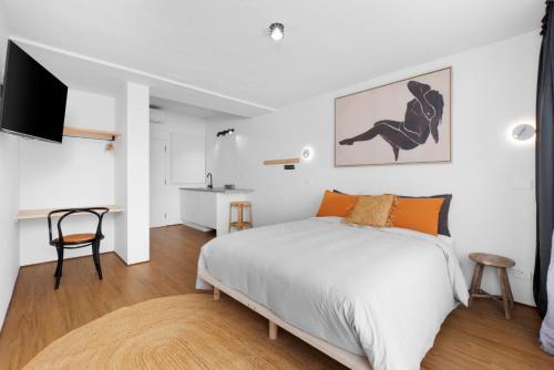 Una cama o camas en una habitación de The Beach Rooms