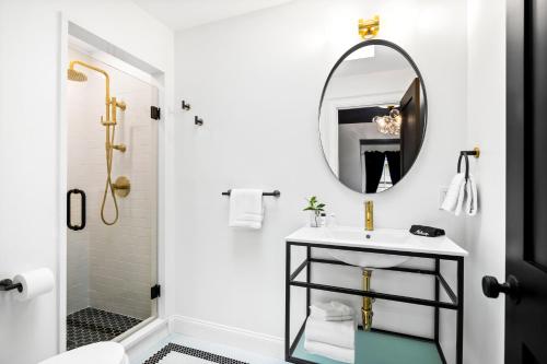 a bathroom with a sink and a mirror at The Coach House in Salem