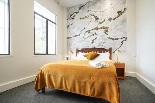 Кровать или кровати в номере Tuatara Lodge