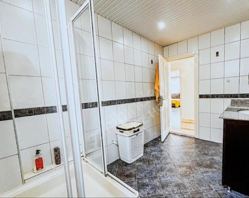 a bathroom with a shower and a sink and a tub at Villa Oliena Sahil in Istanbul