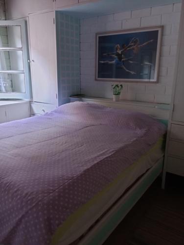 Cama o camas de una habitación en Casa da Roseli - Pitangueiras