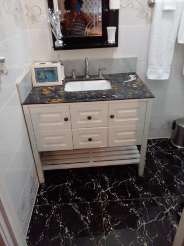a bathroom with a sink and a counter at LEO VILLA in Wallen