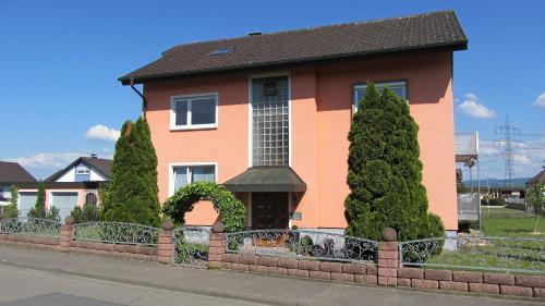 a house with a fence in front of it at Fewo-Barbara-Rust in Rust