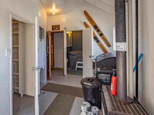 a hallway of a house with a bathroom at Ariki - National Park Holiday Home in National Park