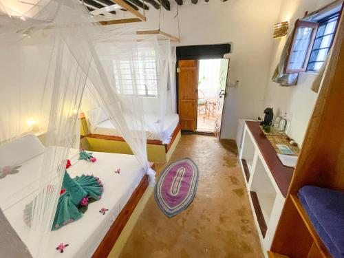 Letto o letti in una camera di HEBE Bungalows Lodge
