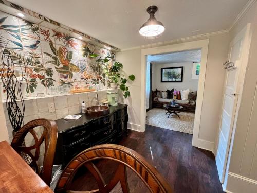 a kitchen with a counter and a dining room at Dougan Suites in Portland