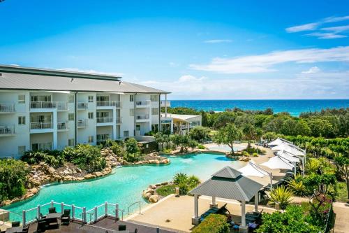 an aerial view of a resort with a pool at 2BR Oceanview Penthouse @ Mantra Salt Resort by uHoliday in Kingscliff