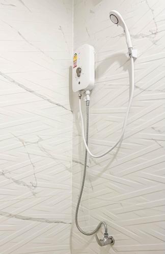 a white electrical outlet on a white wall at Z-Beach Resort in Ban Nong Ban Kao