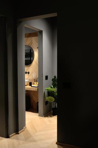 an open door to a bathroom with a sink at Fiorini Rooms Sora in Sora