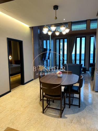 a dining room with a table and chairs at Bonheur at Karambunai in Kota Kinabalu