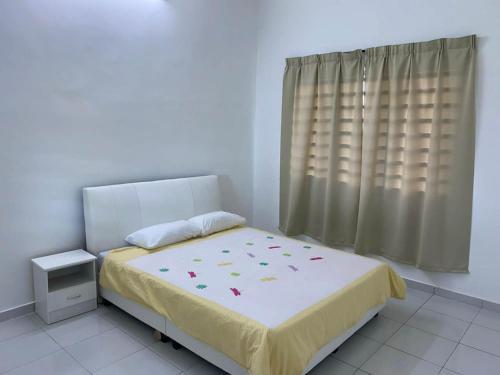 Postel nebo postele na pokoji v ubytování 15 min to Qing Xin Ling Cultural Village Ipoh