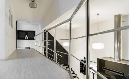 a staircase in a house with glass walls at Vila Carolina Apulum in Alba Iulia