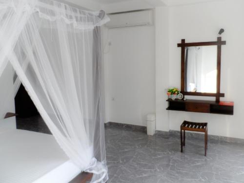 Postel nebo postele na pokoji v ubytování Pearl Island Beach Hotel
