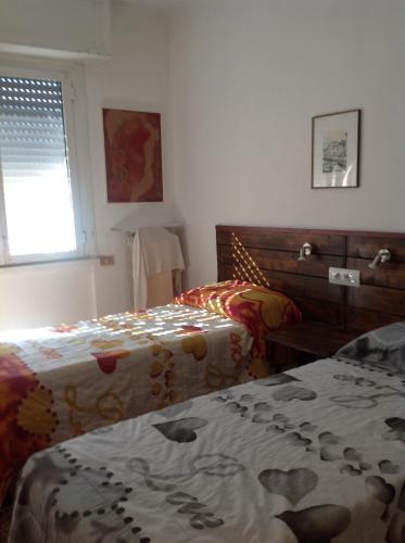 Katil atau katil-katil dalam bilik di Appartamento di Olga