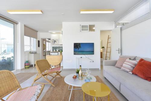 a living room with a couch and chairs and a table at Apartment La Maresia CB9A by VillaGranCanaria in San Agustin