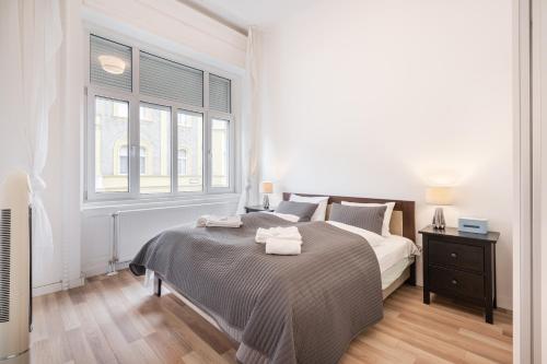 Posteľ alebo postele v izbe v ubytovaní Delta Curve Apartment