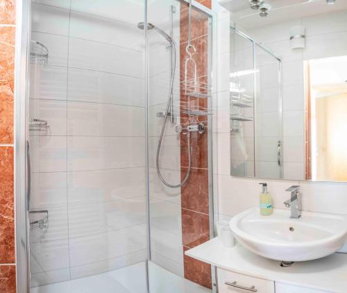 a bathroom with a shower and a sink at Pirchachhof in Wenns