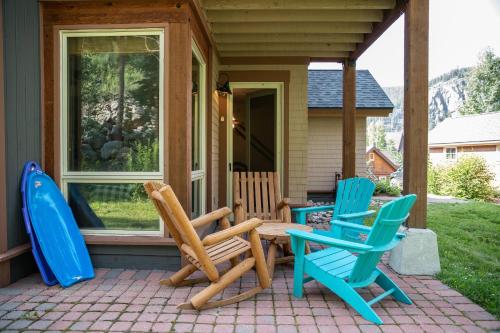 a group of chairs and a table on a porch at 6532 Settlers Creek Condo in Keystone