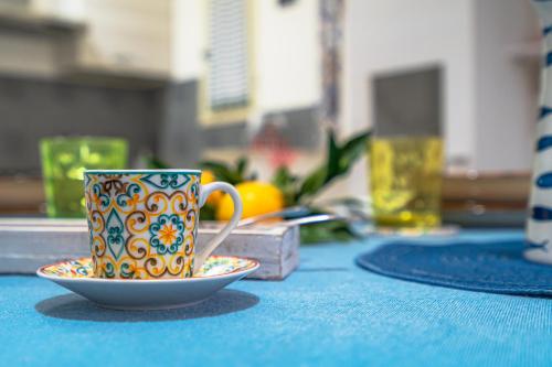 a coffee cup and a saucer on a table at Villetta Granelli in Granelli