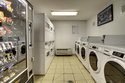 a laundry room with washing machines in a store at InTown Suites Extended Stay High Point NC in High Point