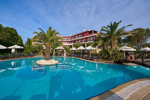 a large swimming pool in front of a hotel at Mediterranean Princess- Adults Only in Paralia Katerinis