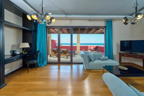 a living room with a view of the ocean at Mediterranean Princess- Adults Only in Paralia Katerinis
