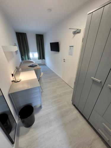 Televisyen dan/atau pusat hiburan di Guesthouse WI rooms