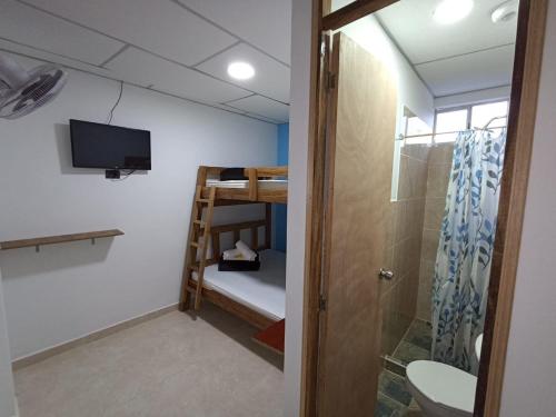 Un ou plusieurs lits dans un hébergement de l'établissement Ekolores Hostal - PARQUE DEL CAFÉ - 313-468-08-41