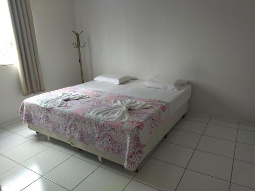 Hotel Caraipeにあるベッド