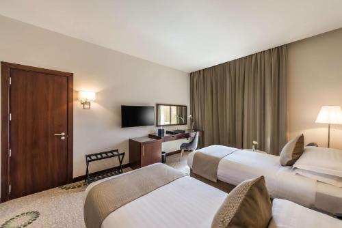 Katil atau katil-katil dalam bilik di Best Western Plus Al Qurayyat City Center