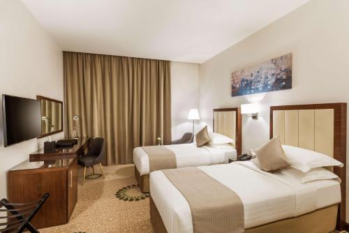 Katil atau katil-katil dalam bilik di Best Western Plus Al Qurayyat City Center