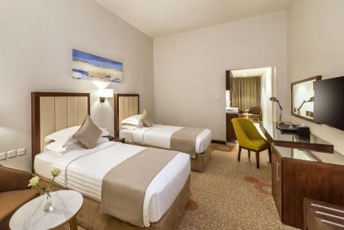 Katil atau katil-katil dalam bilik di Best Western Plus Al Qurayyat City Center