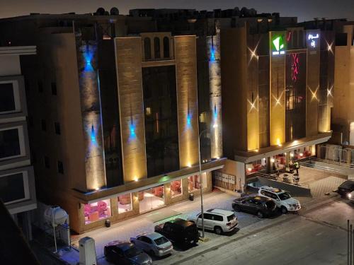 an aerial view of a building at night at نسيم العليا in Al Khobar
