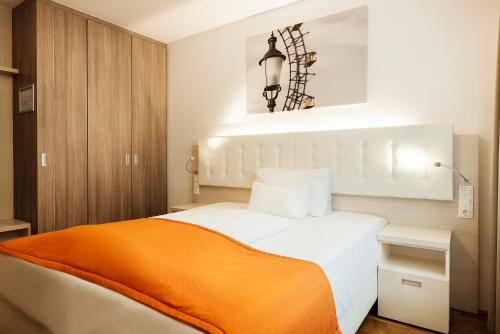 Postel nebo postele na pokoji v ubytování Oliver Apartments | contactless check-in